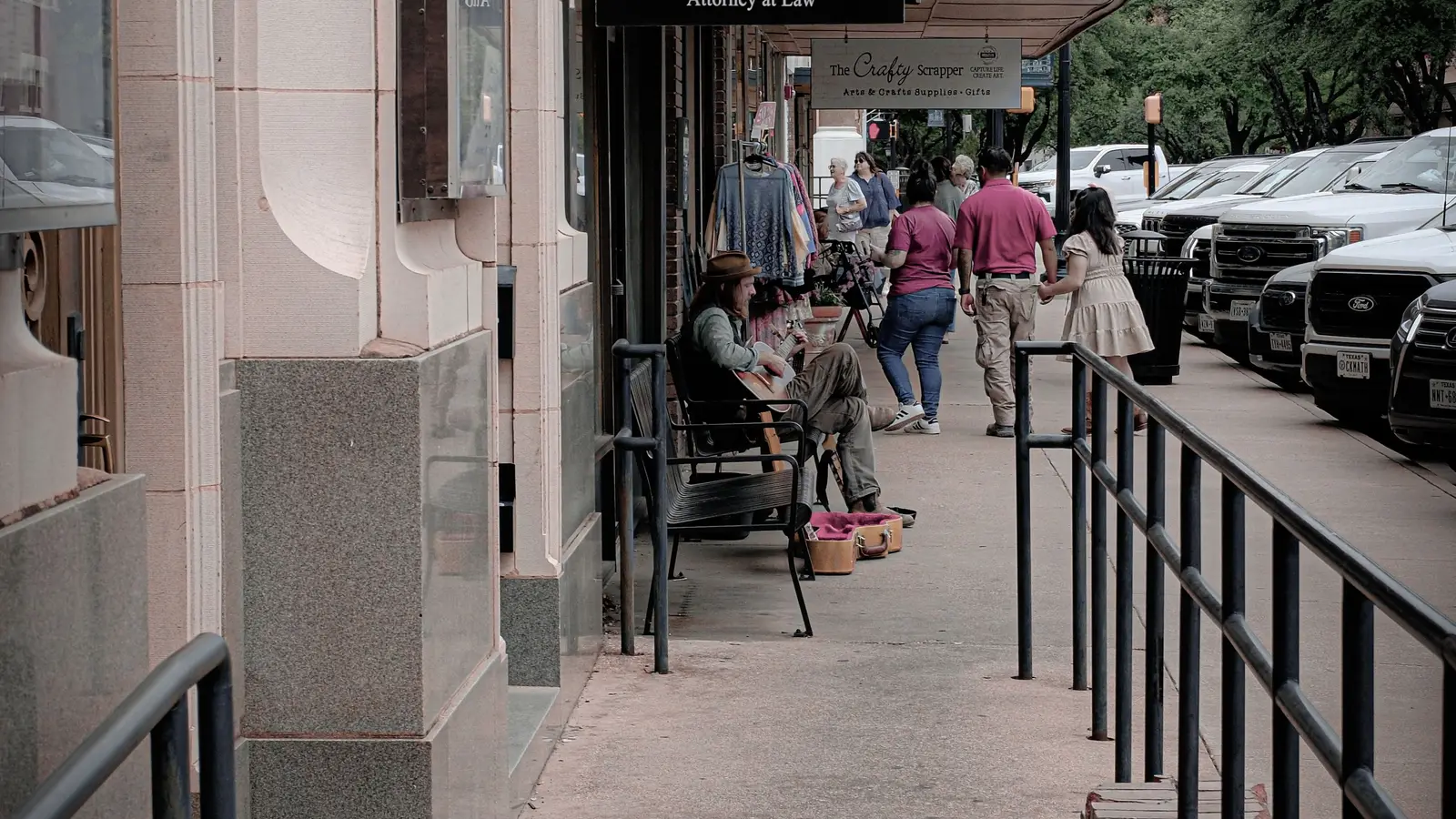 A charming historic small-town Texas street lined with shops